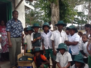Children at Suango getting uniform deliveries... Hats, bags, satchels and tops