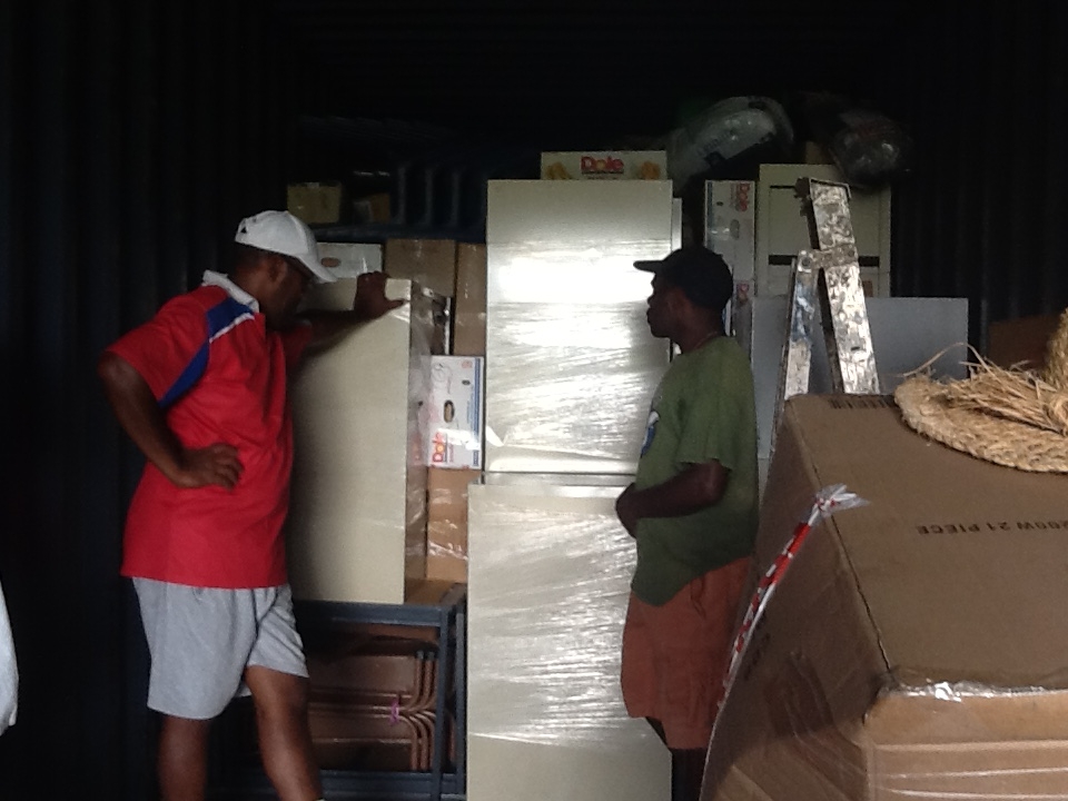 SHaRM Helpers helping with unpacking container