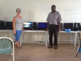 Steph and school Principal Peter with the new computers